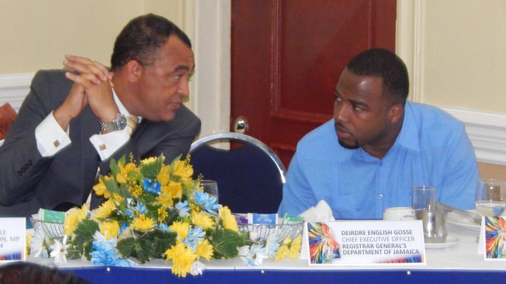 Minister of Health, Dr. Christopher Tufton (L) in discussion with Mr. Charlton McFarlane (R), Deputy Chief Executive Officer and Conference Chair, Registrar General's Department during the official media launch of the Inaugural Caribbean Civil Registration and Identity Management Conference at the Knutsford Court Hotel, Kingston. The Inaugural Caribbean Civil Registration and Identity Management Conference is set to be at the Montego Bay Convention Centre in St. James from July 6-8, 2016.
